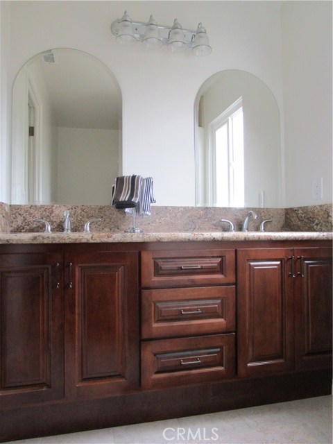 Main bath with granite and lots of storage.