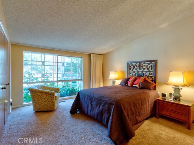 Master bedroom with big windows to the front