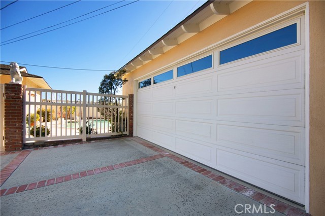 Detached garage with concrete driveway