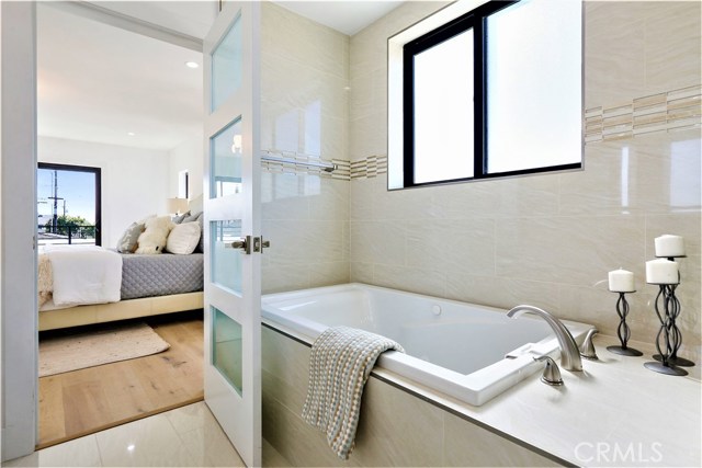 The bath has a well sized Jacuzzi Tub and Deck Surface.