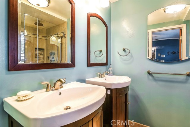 The newly remodeled Master Bath has two charming vanities