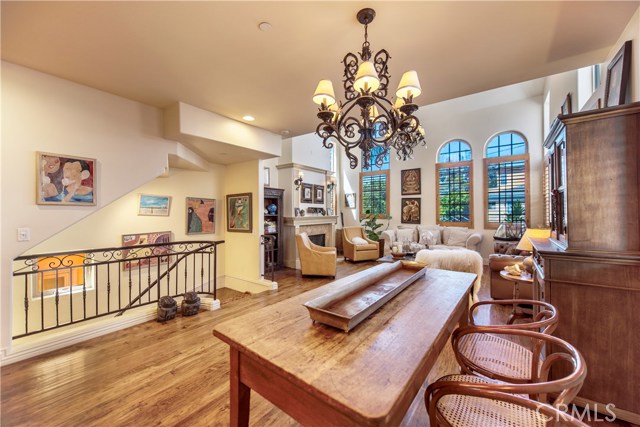 Open floorplan with hardwood floors, soaring ceilings and great light