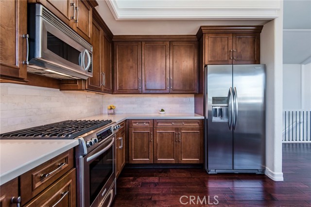 Detailed photo of kitchen - cabinets with pull outs and self closing drawers.