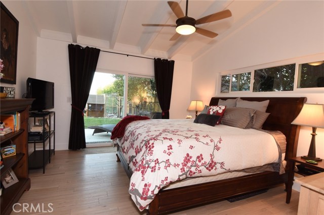 Pretty, romantic master suite has tall ceilings and slider to the rear yard and patio.  Such a wonderful home!
