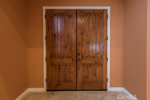 Oversized solid wood front doors.