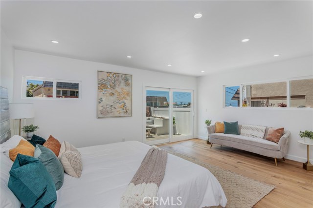 Two bedrooms are located downstairs.  This is the ocean view Master, with double closets and a slider to a wonderful patio.