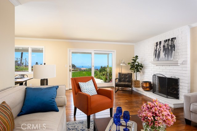 Dining and living room opens to the great ocean view and grassy backyard.