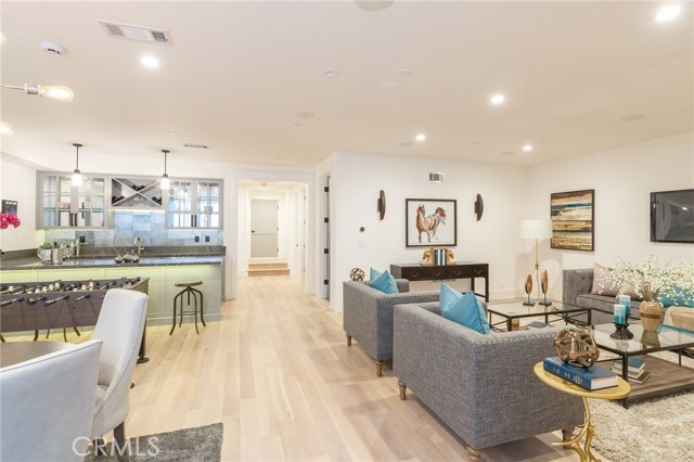 basement showing the wet bar.. surprisingly lots of natural light in this great room