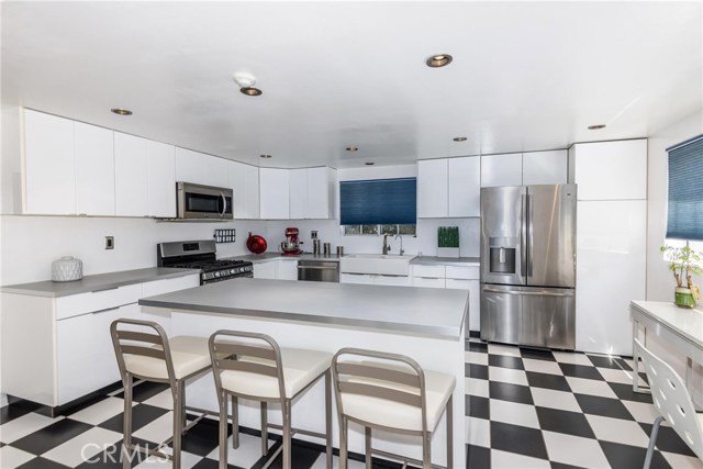 Contemporary remodeled kitchen with center island.