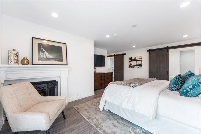 Barn doors in Primary bedroom & gas fireplace