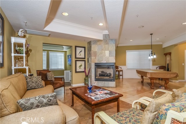 Club house lounge with fireplace and pool table.