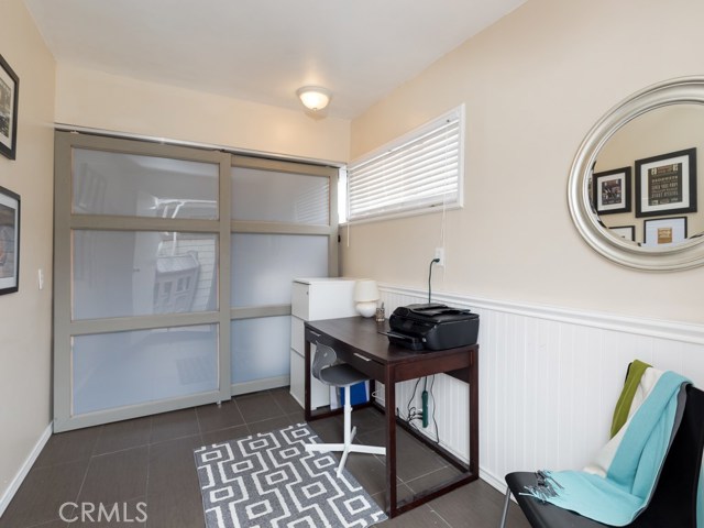 Bonus room/office next to garage with laundry room enclosed behind.