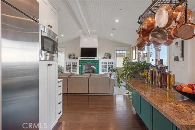You don't miss a thing from this vantage point...tv, fireplace, family/friends are all nearby!