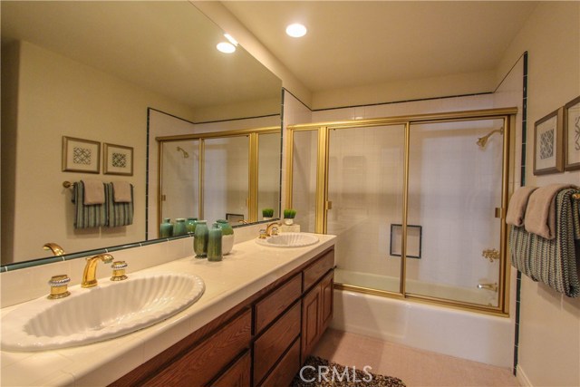 Full bath with dual sinks.