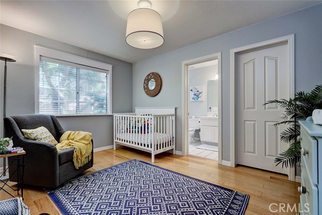 Second bedroom features private ensuite bathroom and walk-in closet.