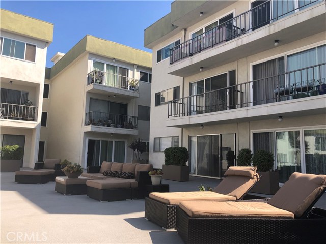 View of unit balcony from courtyard area.