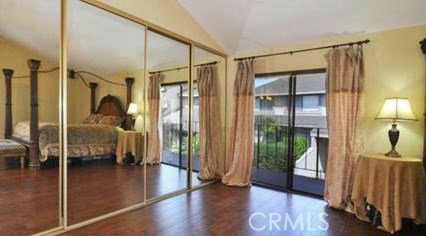 Master bedroom four panel mirrored closet with balcony to add natural light.