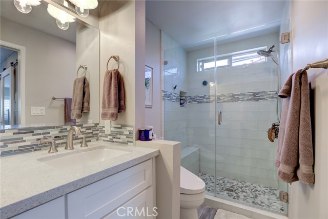 Remodeled bath with walk in shower.