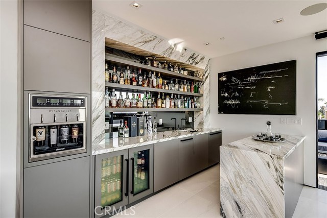 Full bar including dishwasher, ice maker, beverage fridge and wine dispenser.