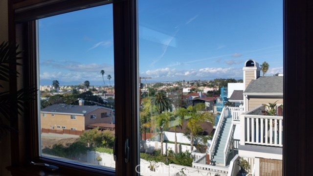 View through upstairs double paned windows looking North. 