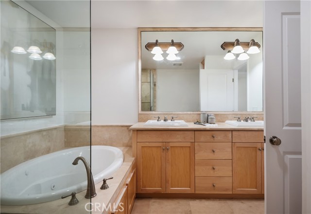 Jetted-tub and additional vanity lights for each sink space.