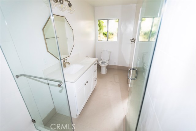 Brand New Master Bath with step in shower, new tile and new cabinets.