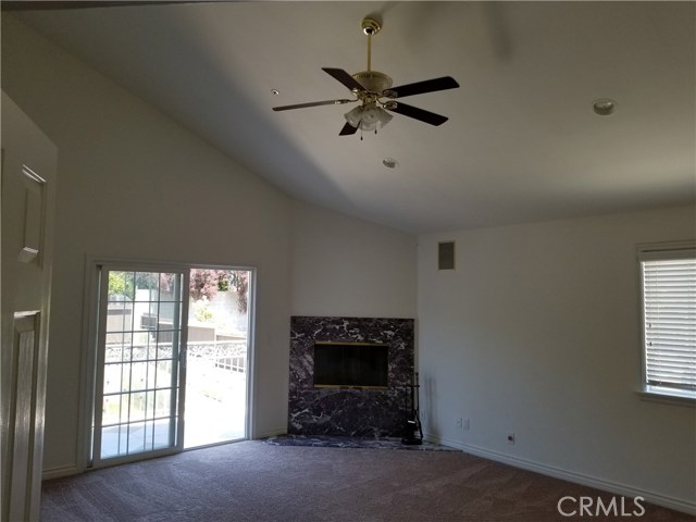 Master bedroom leads to an outdoor balcony overlooking the backyard.