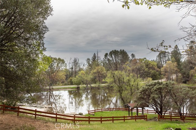 Split rail fencing meanders throughout this magnificent 4 acre parcel.