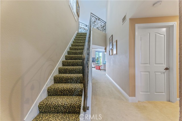 Entry hall and stairs leading to loft.  Custom staircase railings