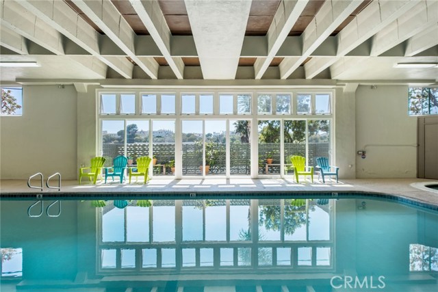 Large heated pool with an adjacent deck for sunbathing