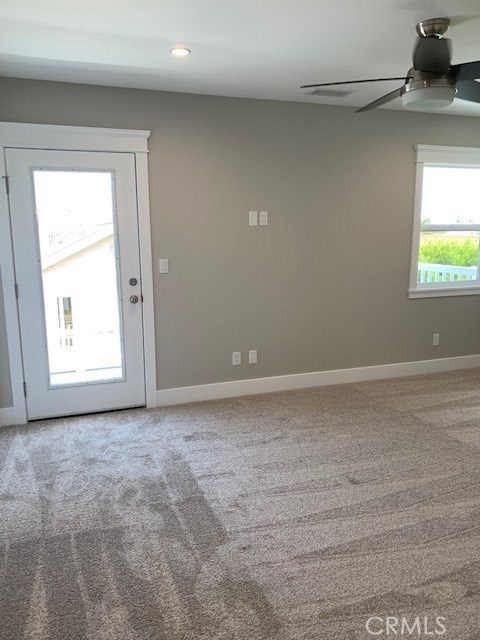 Master Bedroom and door leading to outdoor balcony.