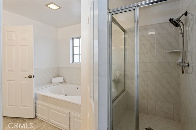 Master Bathroom with separate Jacuzzi tub and large shower.