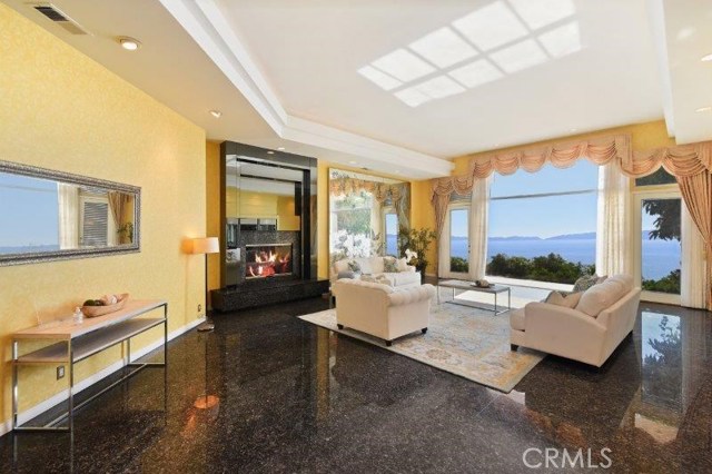 Living Room with Stately Fireplace & Views