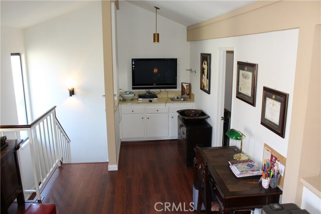Different view of upstairs den. Third bedroom door to the right