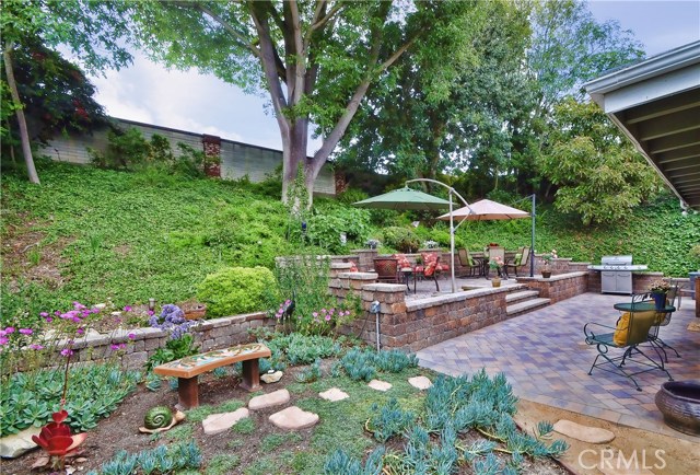 Professionally Landscaped Backyard is a lovely place to relax and entertain family and friends.