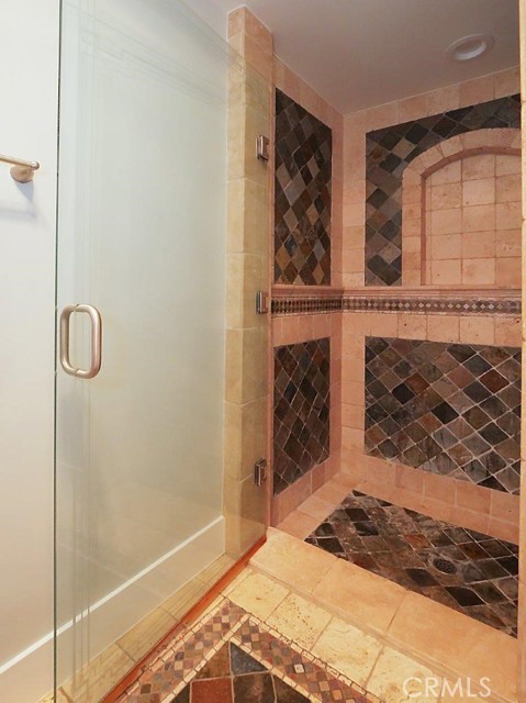 Shower in Lower Level Hallway Bathroom