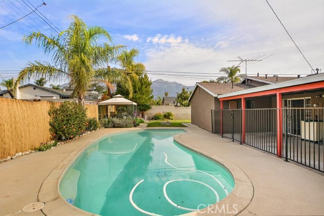 Pool gated with covered patio