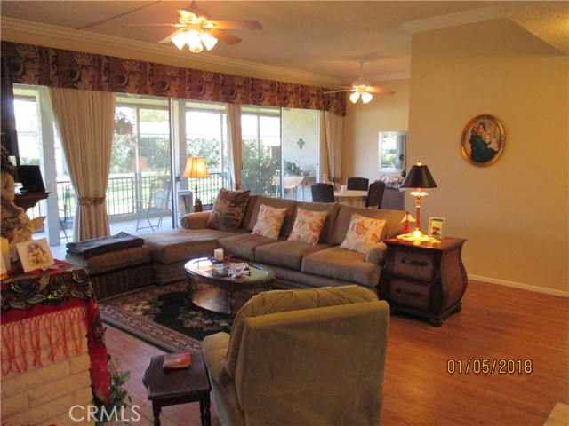 The spacious living room with L-shaped seating.