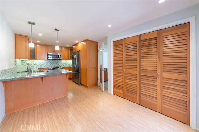 Spacious breakfast nook with beautifully concealed laundry area!