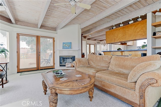 Back Unit- Living Room leading to kitchen and dining area