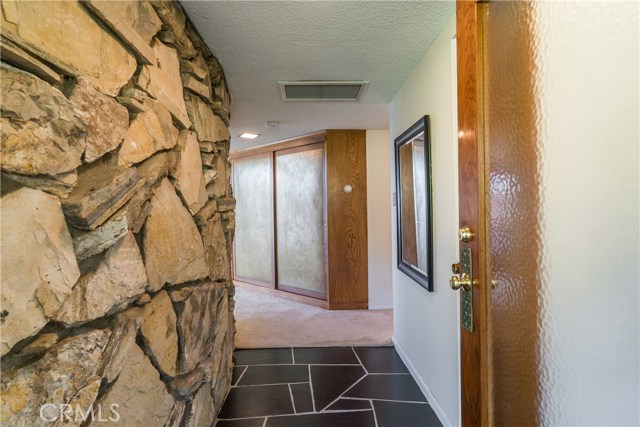 Slate and Palos Verdes Stone entrance.  Original wood and glass door...