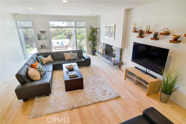 Living room overlooks the back yard.  No adjacent neighbors to the north - just pretty views of treetops and sunsets!