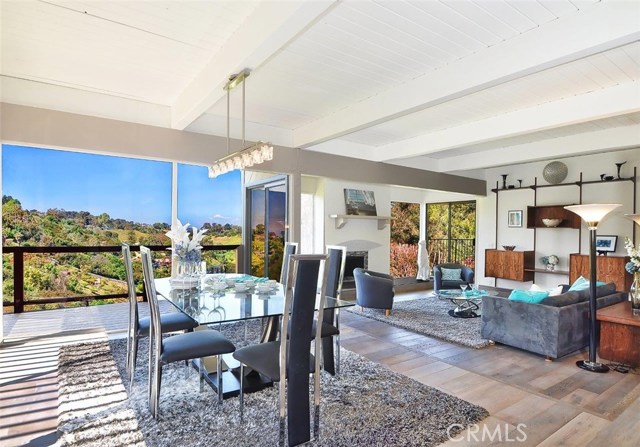 Dining and Living room with floor to ceiling picture windows