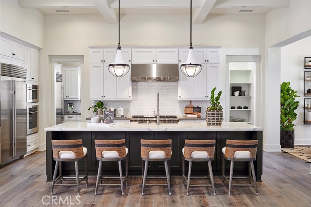Light and bright, welcoming  gourmet chef's kitchen opens to the great room. Model home shown.