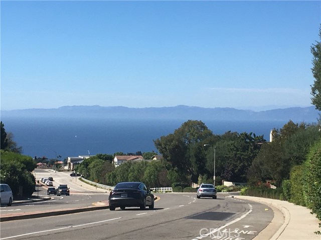 View of Malibu Mountains and South Bay pulling out of Cresta Verde, heading down Crest toward Hawthorne