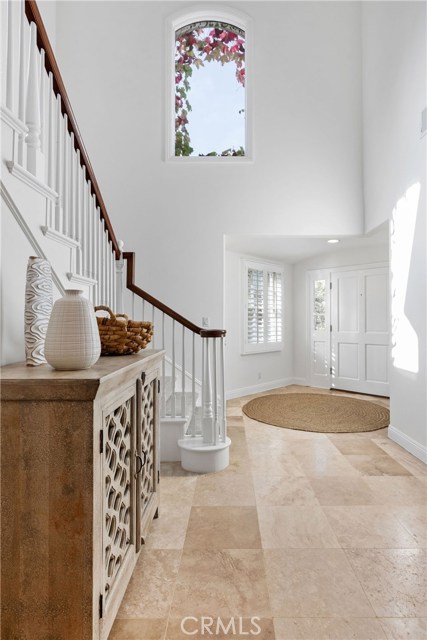 Entry Hall with Beautiful Window Detail Framed with Ivy.  Loads of Light!