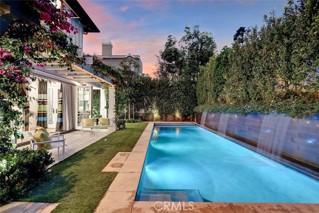 Oversize corner lot allows for a spectacular salt water pool and more!