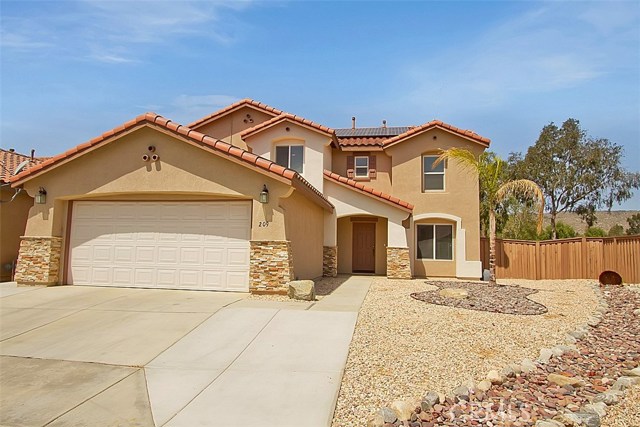 Professionally designed rock landscape, possible RV access behind gate to the right