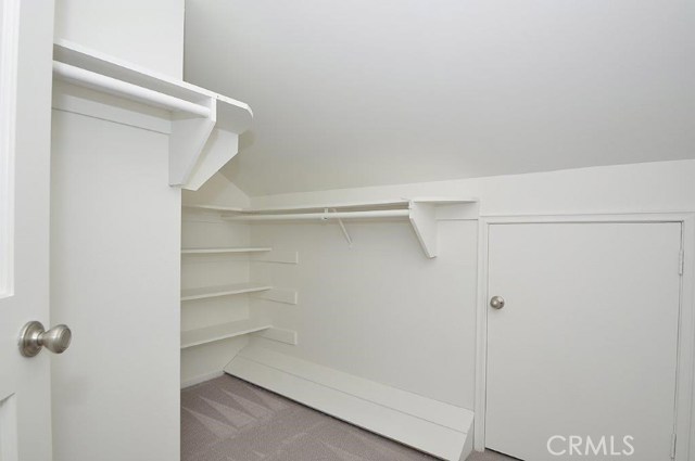 Amazing Walk-in Master Closet with Door to Huge Storage Area over Garage.