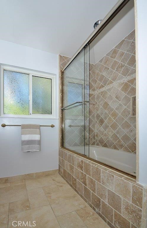 Tumbled Travertine Jetted Tub in Upstairs Hall Bathroom.